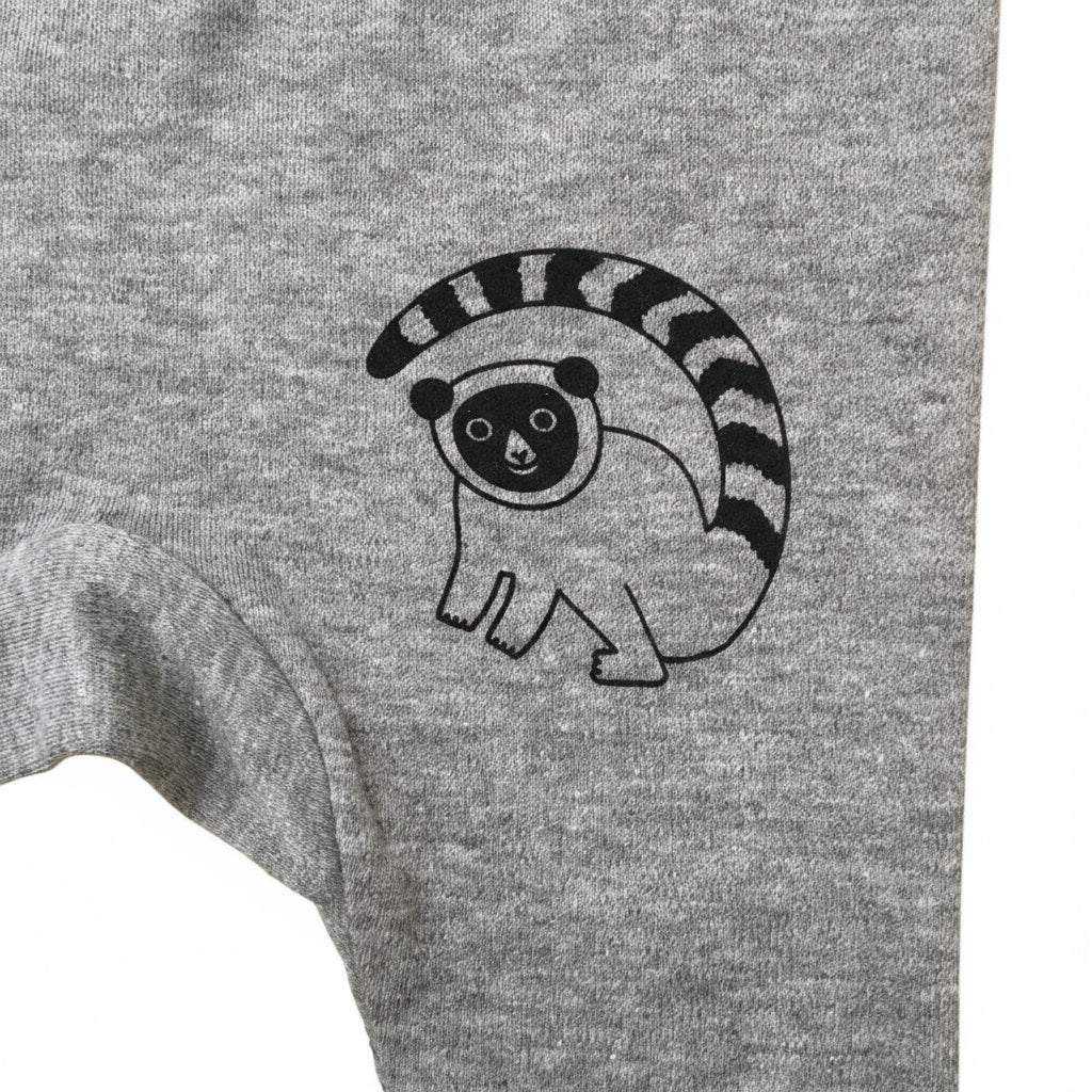Grey organic cotton baby leggings with black lemur design front view close up detail